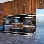 A modern kitchen with flat cabinet doors in high gloss wood