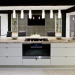 A contemporary styled, monochrome kitchen with flat cabinet doors