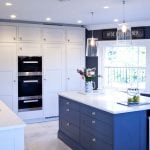 An in-frame style kitchen with shaker doors in fresh white and blue