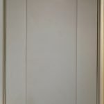 A close-up example of a lay-on kitchen cabinet with shaker doors