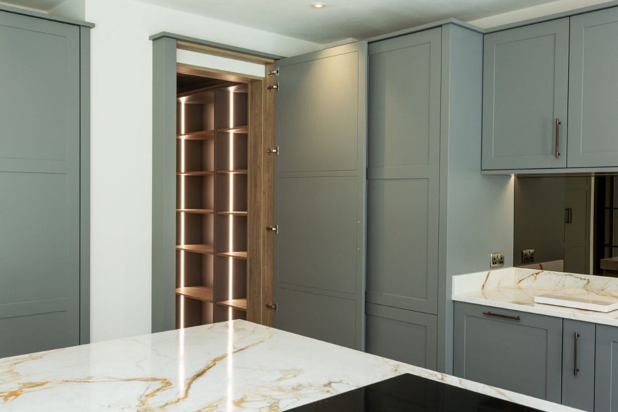 A modern shaker kitchen with floor to ceiling cabinetry.