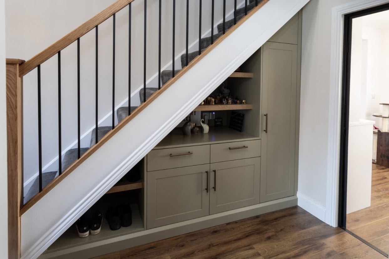 Front view of the stairs showing a full view of the under stair cabinetry.