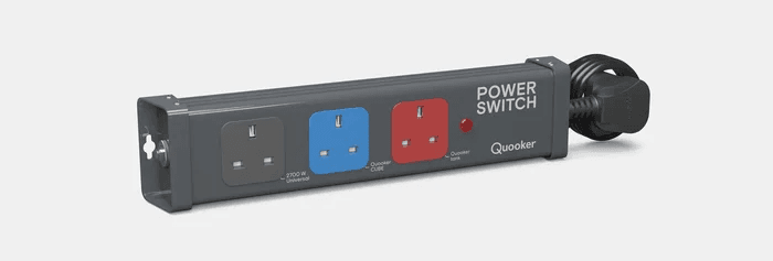 The Powerswitch adapter with three sockets marked black, red and blue to denote the two Quooker appliances and a third-party appliance.