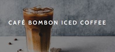A tall glass of creamy coffee with iced and the text Café Bombon Iced Coffee.