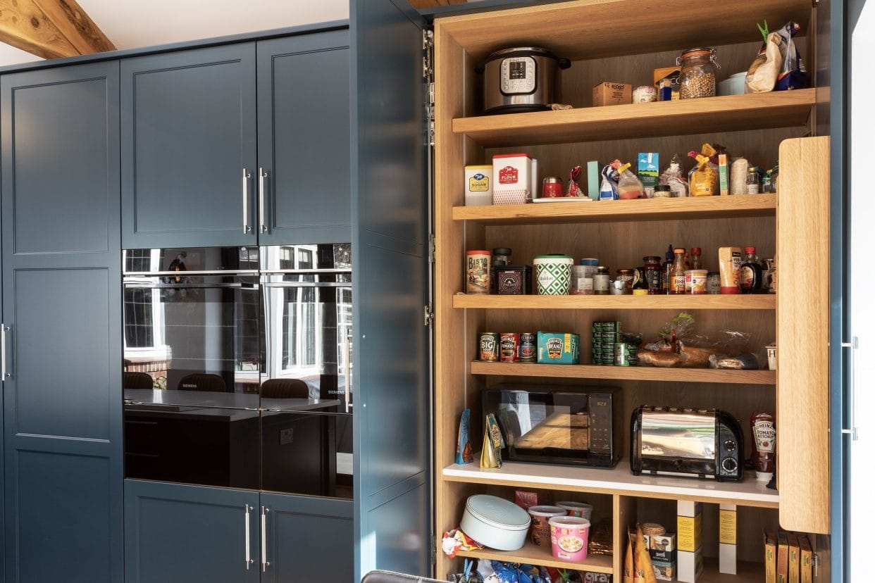 An open, double chef’s larder demonstrating the generous space for ingredients and groceries.