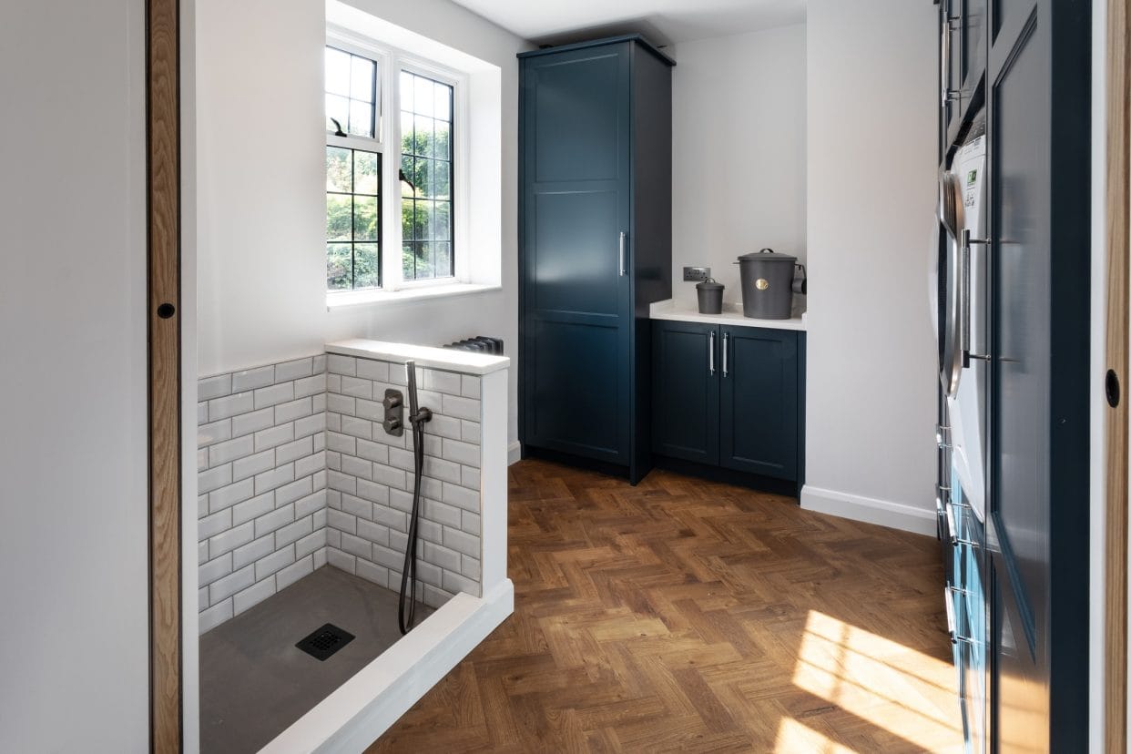 A smart, stylish utility room with a dedicated dog shower.